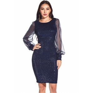 Detail of navy blue sequin dress with semi-transparent organza lantern sleeves