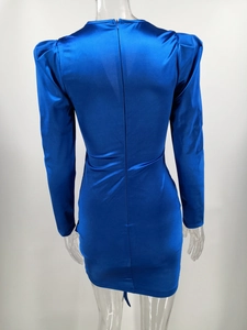 Macro shot of blue satin dress back featuring invisible zipper and puff sleeve detail