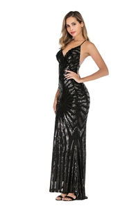 Detail of elegant V-neck sequined evening gown showing geometric patterns and open back
