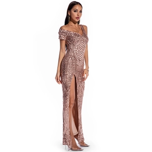 Detailed close-up of rose gold sequin embroidery and high slit on evening gown