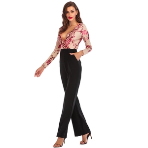 Close-up of elegant V-neck sequin bodice and high-waisted black wide-leg trousers jumpsuit