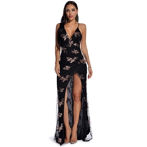 Close-up of black lace evening dress with rose gold sequin embroidery and high slit
