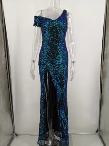 Detailed view of dark blue and emerald sequin embroidery on an off-shoulder gown