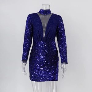 Detail of sequin texture and sheer mesh deep V-neck on a long sleeve party dress