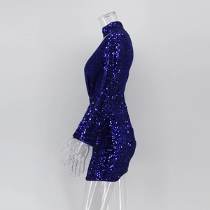Detail of royal blue sequin dress featuring tight long sleeves and a high neckline