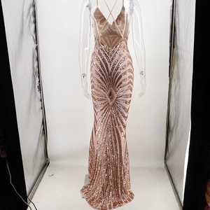 Detail of rose gold sequin evening dress featuring a cross-back design and mermaid silhouette