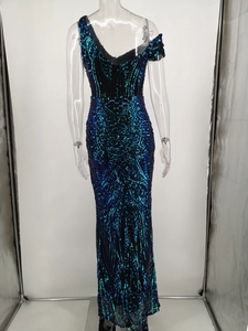 Back view of a sequined one-shoulder fishtail gown with blue and green geometric patterns