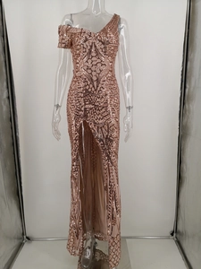 Detail of rose gold sequin evening gown showing the asymmetric shoulder and high side slit