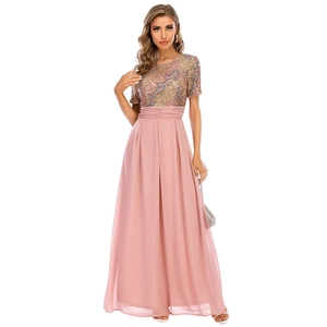 Detail of sequined short-sleeve bodice and pink chiffon maxi skirt for evening wear