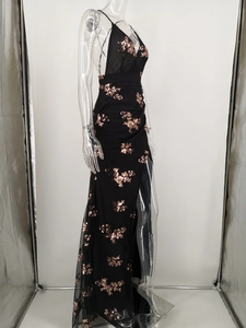 Detail of rose gold floral sequins on a black high-slit backless evening gown