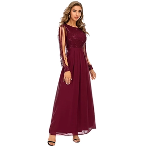 Detail of burgundy sequins and elegant long fringe sleeves on a chiffon maxi dress