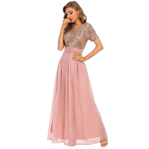 Detailed view of sequined bodice and pleated waist on a pink chiffon maxi dress