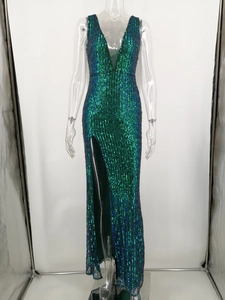 Detail of sequin evening dress showing deep V-neck and emerald green shimmering texture