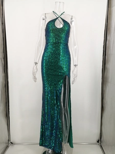 Detail of emerald green sequined evening dress with halter neck and teardrop cutout