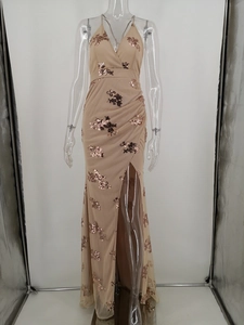 Detail of champagne evening gown featuring rose gold sequin floral embroidery and V-neckline