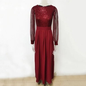 Detail of burgundy sequin bodice and sheer mesh sleeves on a long chiffon formal dress