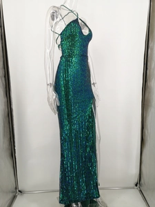 Detail of emerald sequined gown featuring halter neckline and teardrop cutout