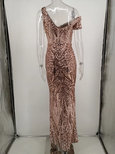 Detail of rose gold sequin dress featuring low back V-neck and geometric pattern