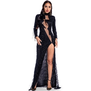 Close-up of black sequined gown featuring sheer mesh cutouts and fringe detail