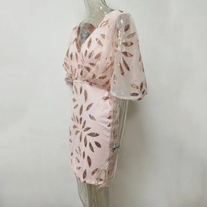 Detailed view of pink sequin leaf embroidery on a deep V-neck evening party dress