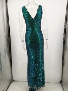 Detail of a slim backless evening dress featuring gradient blue and green sequins