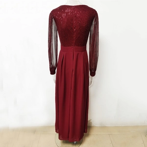 Detailed back view of dark red sequin dress with sheer sleeves and zipper