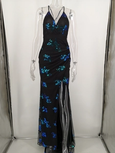 Detail of sequin evening dress with deep V-neckline and blue patterned sequins