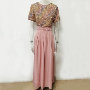 Detail view of shimmering sequin bodice and high-waist chiffon skirt on party dress