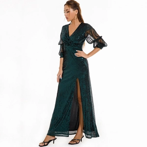 Elegant emerald green sequin maxi dress with deep V-neck and high side slit detail