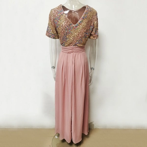 Detail of sequined V-neck bodice and flowing chiffon skirt on back of pink maxi dress