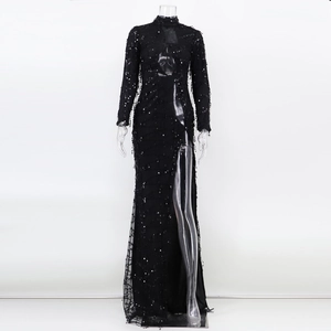 Detail of high neck long sleeve sequin dress with mesh panels and side leg slit