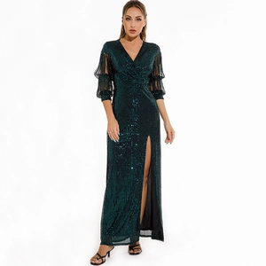 Elegant dark green sequin evening dress with deep V-neck, high slit, and sheer puff sleeves