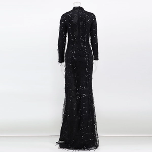 Detailed back view of a black sequined evening gown with mesh stitching and wavy patterns