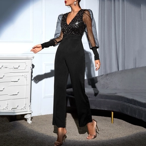 Detail of sexy deep V-neck sequined bodice with sheer mesh puff sleeves on black jumpsuit
