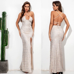 Sexy silver sequin backless maxi evening dress with halter neck and high leg slit detail