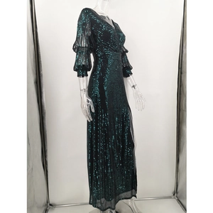 Detail of dark green sequin maxi dress featuring layered lantern sleeves and V-neckline