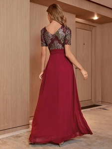 Detailed back view of a sequin patchwork chiffon evening gown with elegant V-neck design
