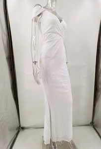 Detailed side view of white sequin evening gown with elegant pleated bodice and mermaid cut