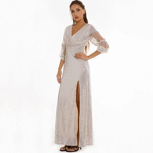 Detail of silver sequin evening dress featuring hollow bubble sleeves and a high side slit