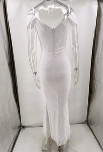 Detailed back view of a white sequin evening gown with a V-neck cut and invisible zipper