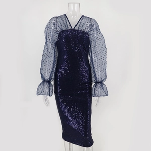 Detail of sequined midi dress featuring blue mesh dot sleeves and ruffled cuff design