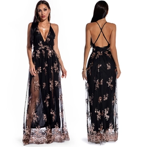 Sexy black sequined evening gown featuring a deep V-neck, cross back straps and side slit