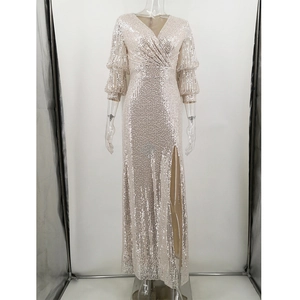 Detailed view of champagne sequin dress featuring V-neck and high side slit