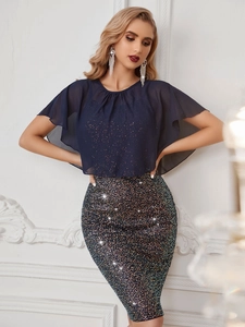 Detail of dark blue chiffon cape top and shimmering sequin bodycon skirt set