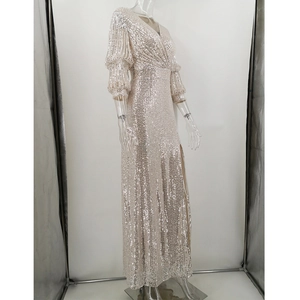 Detailed close-up of champagne sequin evening dress featuring V-neck and high split cut