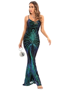 Detailed view of teal sequin embroidery and dynamic geometric patterns on a black dress