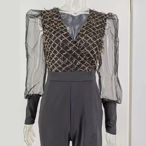 Sexy black jumpsuit featuring sequin V-neck bodice and sheer puff lantern sleeves