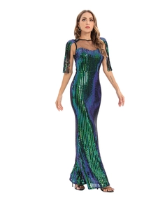 Detail of green and purple gradient sequins and black bead tassels on the evening dress