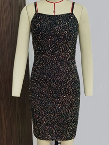 Detail shot of black bodycon dress featuring sparkling multi-colored sequins and thin straps