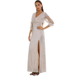 Elegant silver sequin evening gown with deep V-neck, long lantern sleeves and high slit